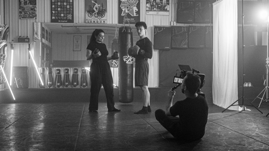 Filming a boxing scene on location