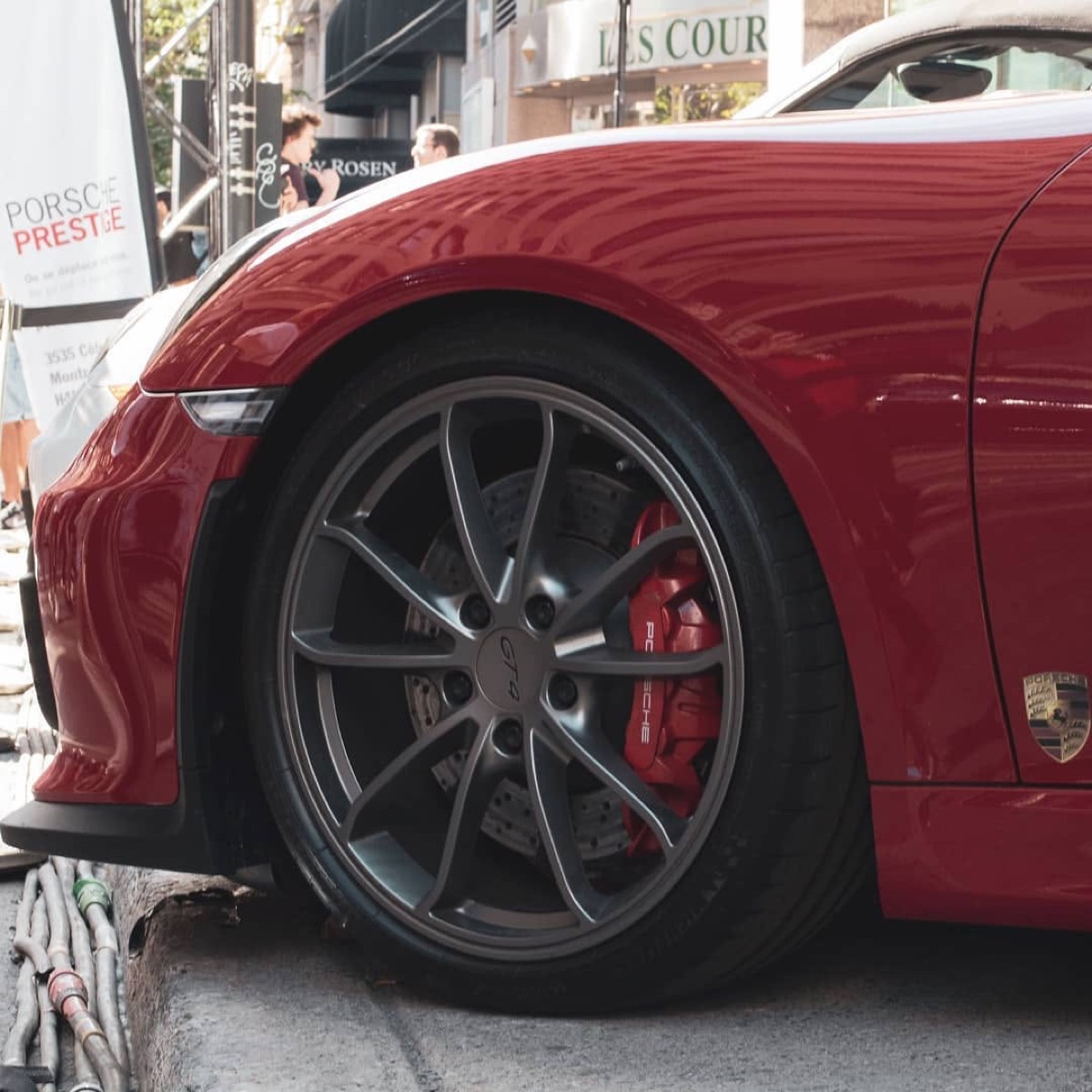 Detail photograph of a red sports car wheel